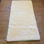 Unterfütterte Betteinlage aus Lammfell